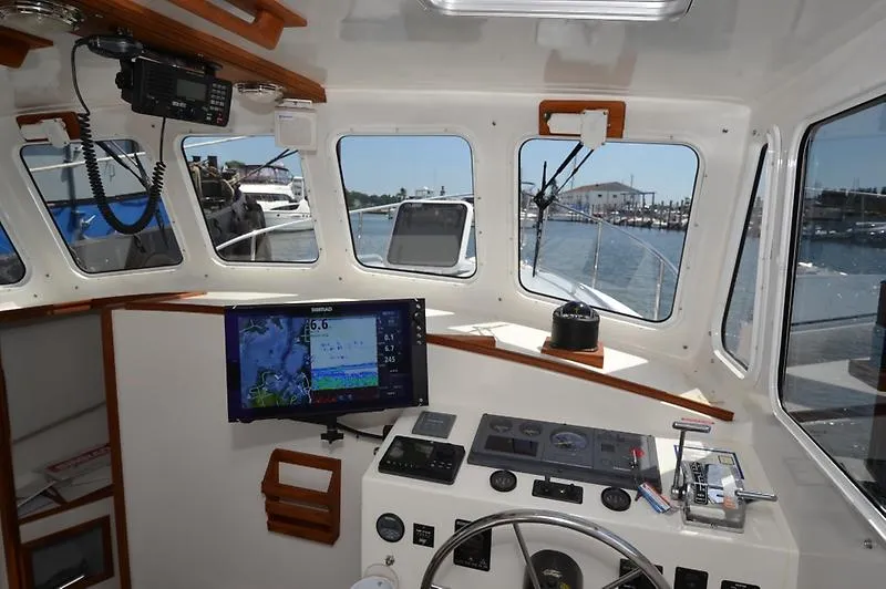 Grey Goose Yacht Photos Pics Interior view of 2002 West Bay 31 boat cockpit with navigation equipment.
