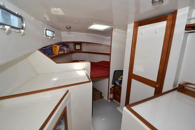 Grey Goose Yacht Photos Pics Interior of 2002 West Bay 31 boat with cozy cabin and wooden accents.