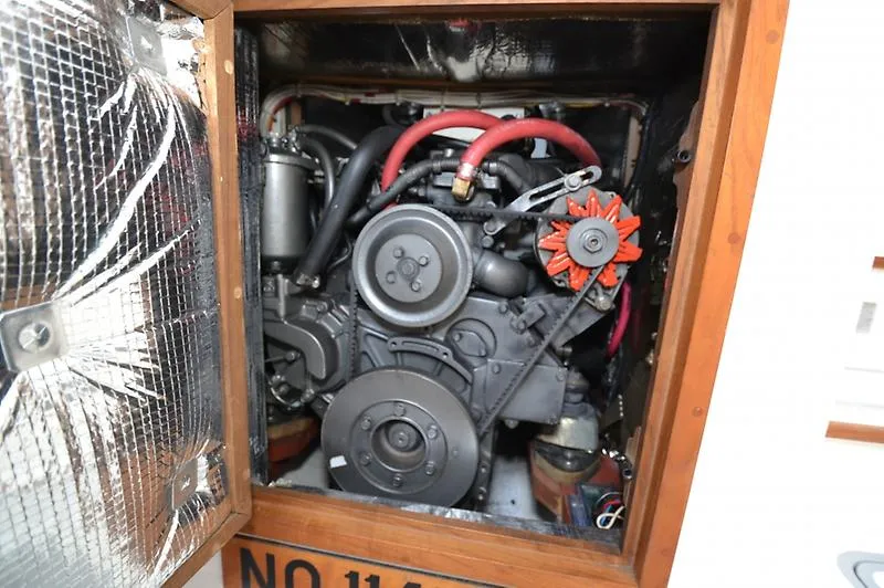 Grey Goose Yacht Photos Pics Engine compartment of a 2002 West Bay 31 boat, featuring visible components and red hoses.