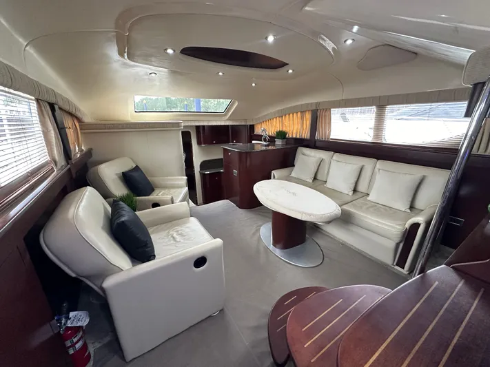 Debs Dinghy Yacht Photos Pics Luxurious interior of 2007 Sea Ray 40 Motor Yacht with plush seating and elegant design.