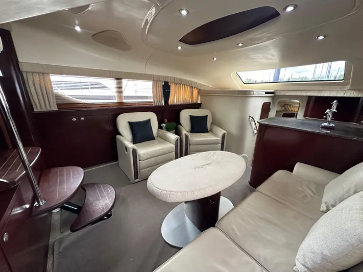 Debs Dinghy Yacht Photos Pics Luxurious interior of 2007 Sea Ray 40 Motor Yacht with plush seating and elegant design.