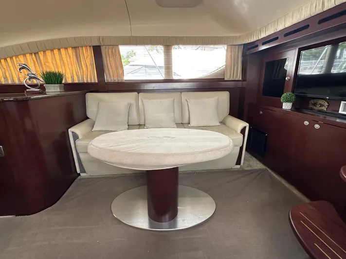 Debs Dinghy Yacht Photos Pics Luxurious interior of 2007 Sea Ray 40 Motor Yacht with elegant seating and table.