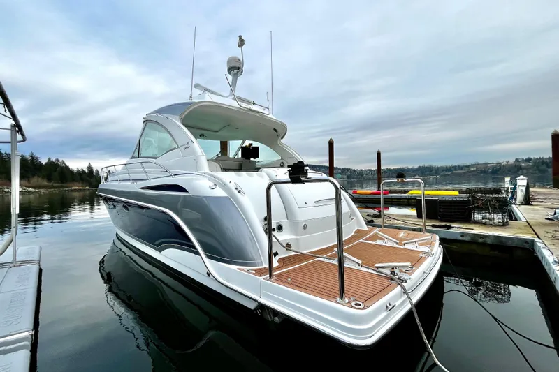 Formula 45 Yacht Photos Pics 2008 Formula 45 Yacht docked on calm water under cloudy skies.