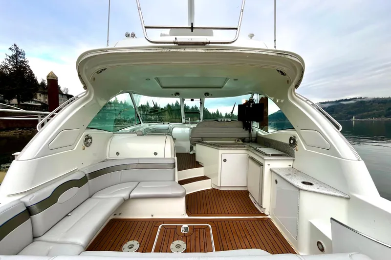 Formula 45 Yacht Photos Pics 2008 Formula 45 Yacht interior with sleek seating and modern amenities on a serene water backdrop.