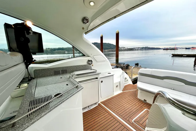 Formula 45 Yacht Photos Pics 2008 Formula 45 Yacht interior with sleek design, featuring a kitchenette and waterfront view.