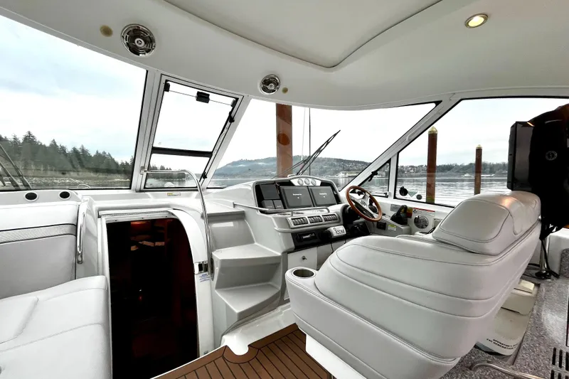 Formula 45 Yacht Photos Pics Interior view of 2008 Formula 45 Yacht cockpit with modern controls and leather seating.