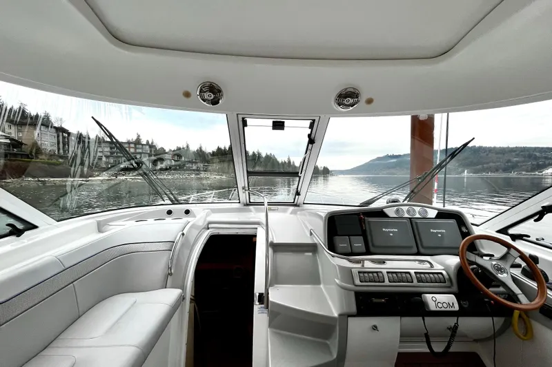 Formula 45 Yacht Photos Pics Interior view of 2008 Formula 45 Yacht cockpit with scenic waterfront backdrop.