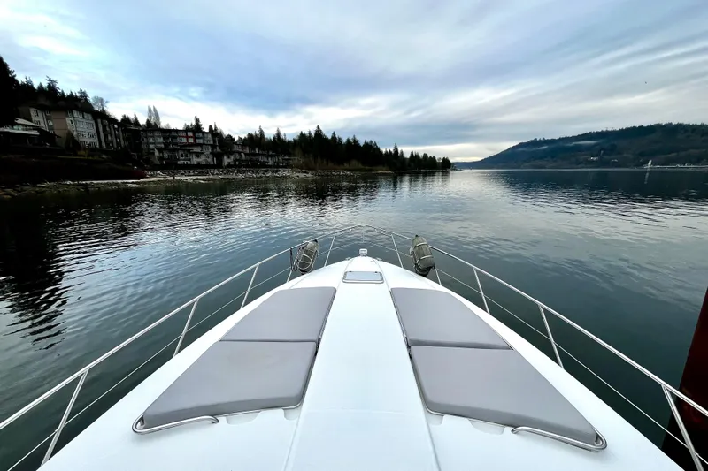 Formula 45 Yacht Photos Pics 2008 Formula 45 Yacht cruising on a serene lake with scenic forested shoreline.