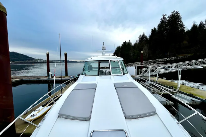 Formula 45 Yacht Photos Pics 2008 Formula 45 Yacht docked at a serene marina with forested backdrop.
