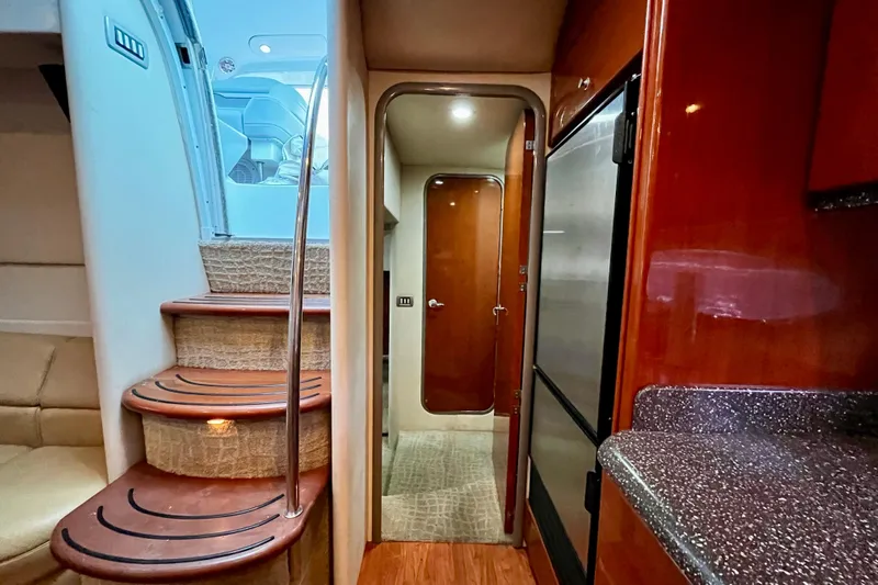 Formula 45 Yacht Photos Pics Interior of 2008 Formula 45 Yacht with stairs, kitchenette, and hallway view.