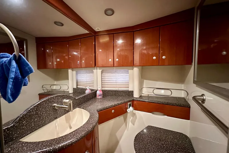 Formula 45 Yacht Photos Pics Luxurious bathroom in 2008 Formula 45 Yacht with sleek wood cabinets and modern fixtures.