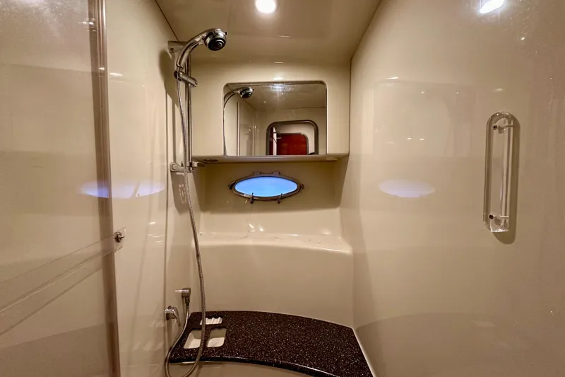 Formula 45 Yacht Photos Pics Luxurious bathroom in 2008 Formula 45 Yacht with shower and porthole window.