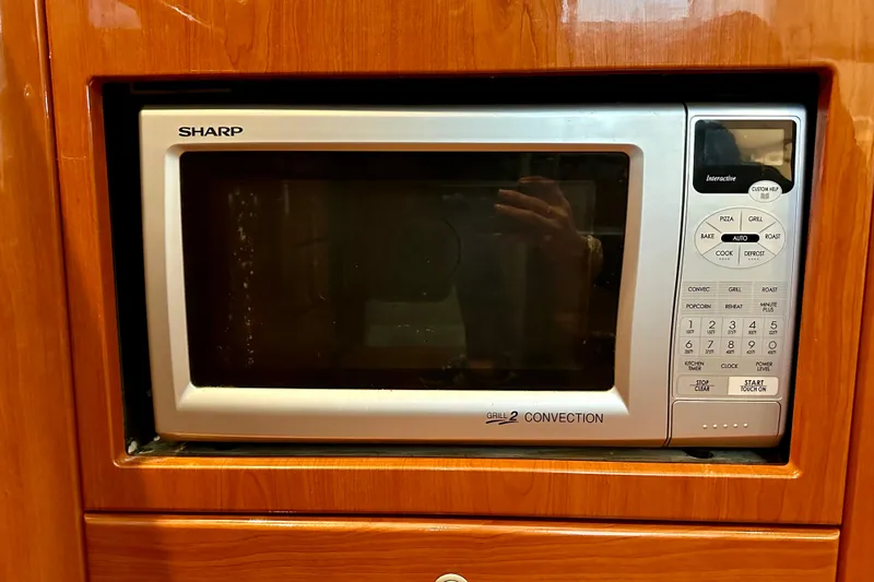 Formula 45 Yacht Photos Pics Sharp microwave in wooden cabinet on 2008 Formula 45 Yacht.