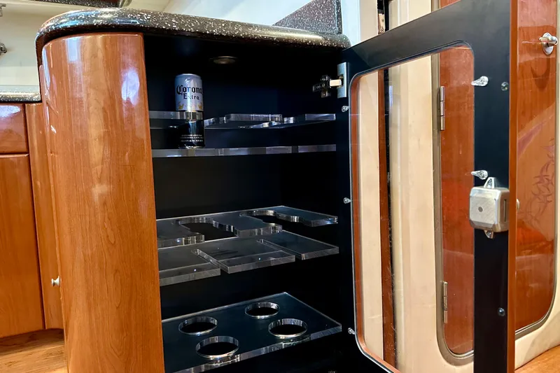 Formula 45 Yacht Photos Pics 2008 Formula 45 Yacht interior cabinet with glass door and drink storage.