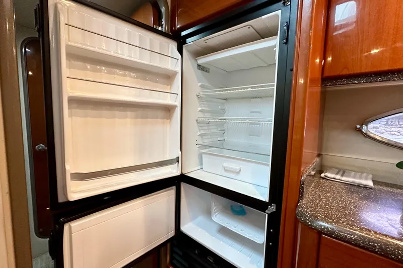 Formula 45 Yacht Photos Pics Open refrigerator inside 2008 Formula 45 Yacht, featuring spacious shelves and modern design.