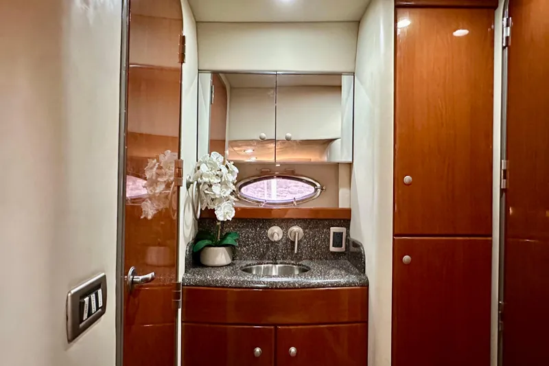 Formula 45 Yacht Photos Pics Luxurious 2008 Formula 45 Yacht bathroom with wood cabinetry and elegant sink area.