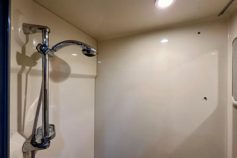 Formula 45 Yacht Photos Pics Shower area in 2008 Formula 45 Yacht with chrome fixtures and recessed lighting.