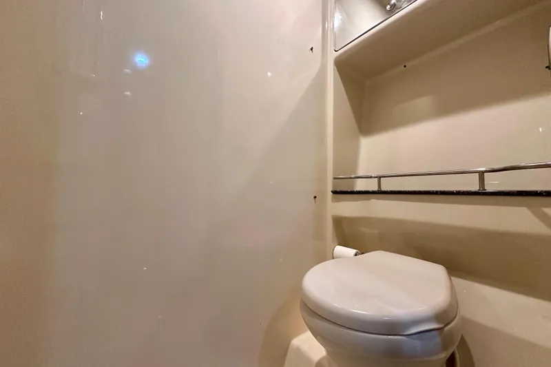 Formula 45 Yacht Photos Pics 2008 Formula 45 Yacht bathroom with toilet and shelving.