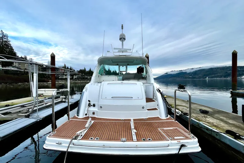 Formula 45 Yacht Photos Pics 2008 Formula 45 Yacht docked on calm waters under a cloudy sky.