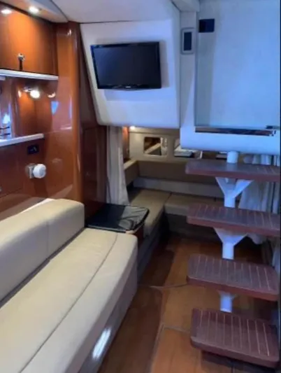  Yacht Photos Pics Interior of 2013 Sea Ray 330 Sundancer yacht with modern seating and TV.