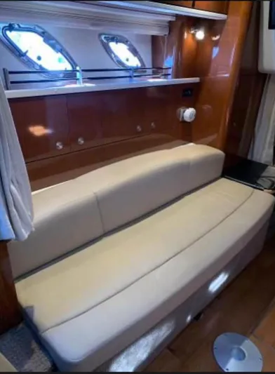  Yacht Photos Pics Interior of 2013 Sea Ray 330 Sundancer with beige seating and wooden accents.