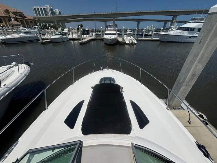  Yacht Photos Pics 2013 Sea Ray 330 Sundancer docked at marina with bridge in background.