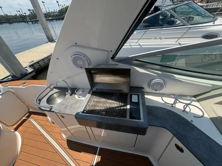  Yacht Photos Pics Outdoor kitchen on 2013 Sea Ray 330 Sundancer yacht with grill and sink.