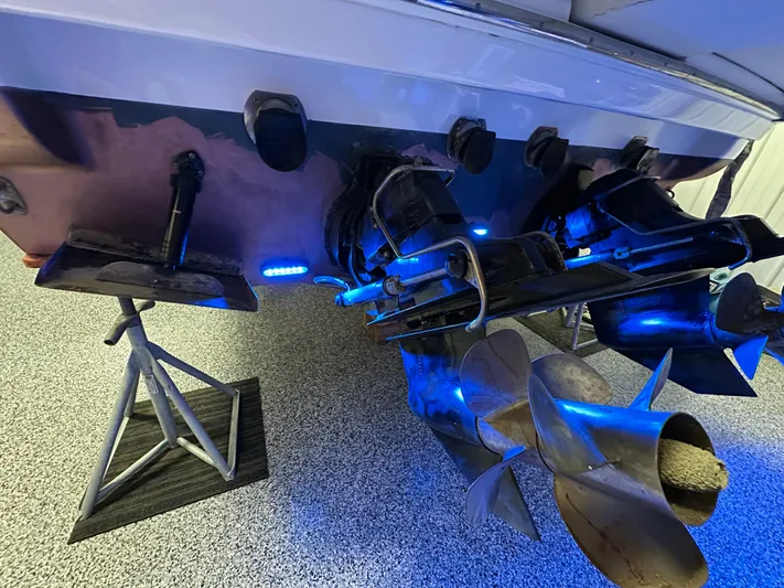  Yacht Photos Pics 2014 Formula 370 Super Sport boat propellers with blue lighting in a garage setting.