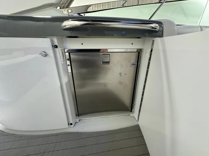  Yacht Photos Pics 2014 Formula 370 Super Sport boat interior with stainless steel refrigerator.