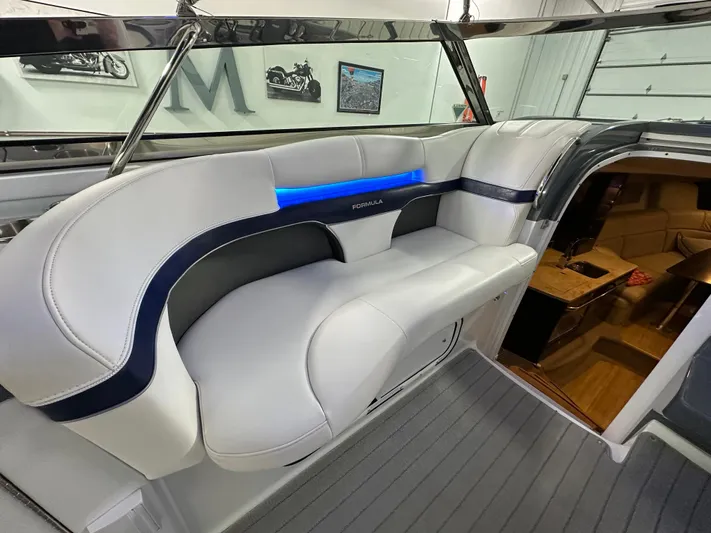  Yacht Photos Pics 2014 Formula 370 Super Sport boat interior with white seating and blue accent lighting.
