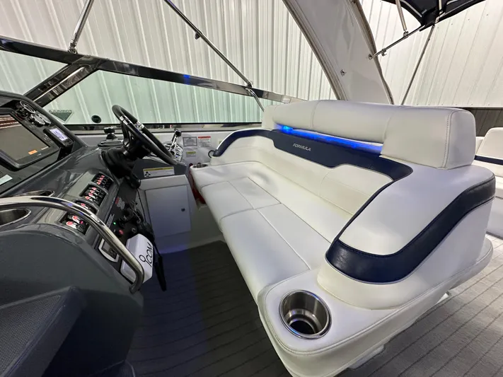  Yacht Photos Pics 2014 Formula 370 Super Sport boat interior with white leather seating and modern dashboard.