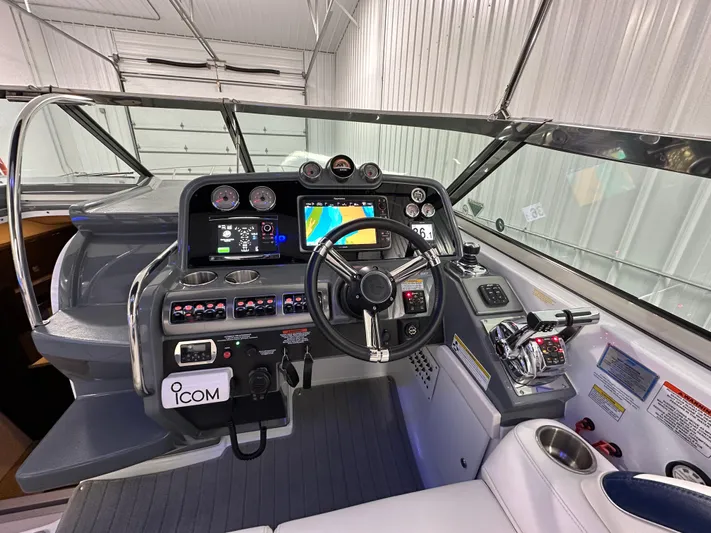  Yacht Photos Pics 2014 Formula 370 Super Sport boat cockpit with advanced navigation controls and steering wheel.