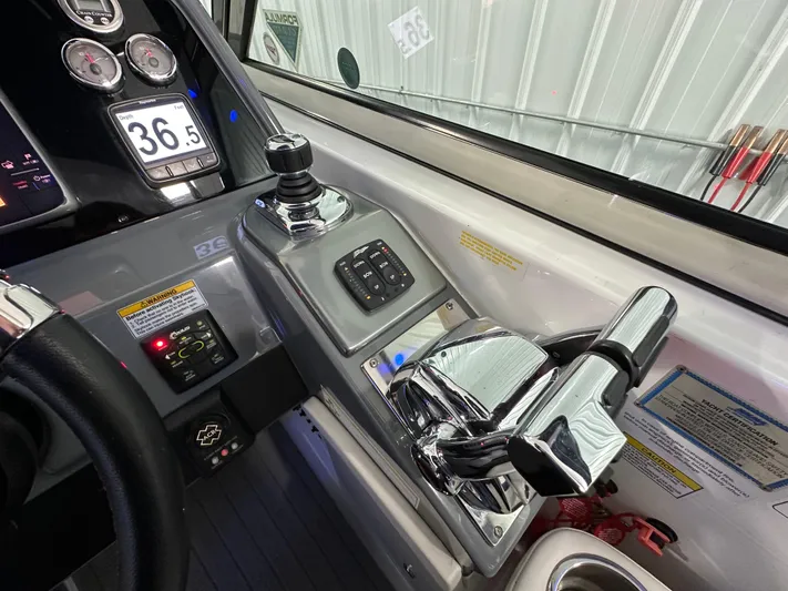  Yacht Photos Pics Control panel of a 2014 Formula 370 Super Sport boat with chrome throttle levers.