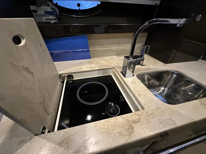  Yacht Photos Pics 2014 Formula 370 Super Sport yacht kitchen with stove and sink.