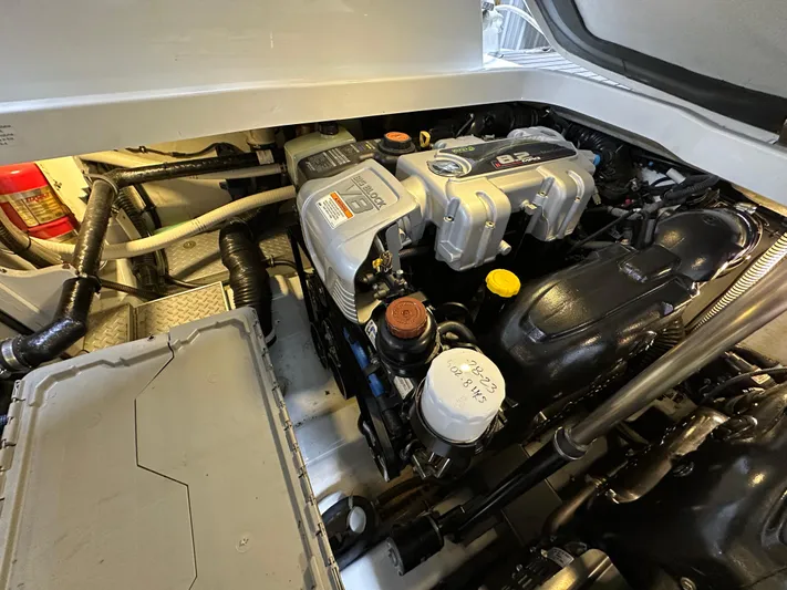  Yacht Photos Pics Engine compartment of a 2014 Formula 370 Super Sport boat, showcasing detailed components.