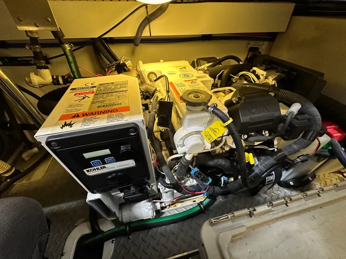  Yacht Photos Pics Engine compartment of a 2014 Formula 370 Super Sport boat, featuring detailed machinery.