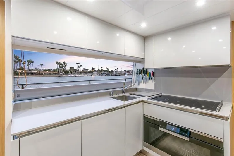 Lontano Yacht Photos Pics Modern kitchen interior on 2016 Ferretti 960 yacht with ocean view.