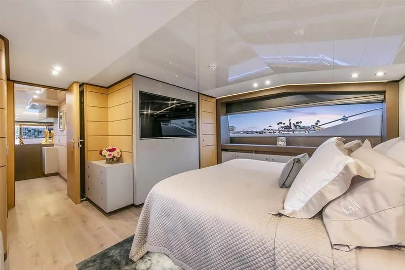 Lontano Yacht Photos Pics Luxurious bedroom interior of 2016 Ferretti 960 yacht with modern decor and large window view.