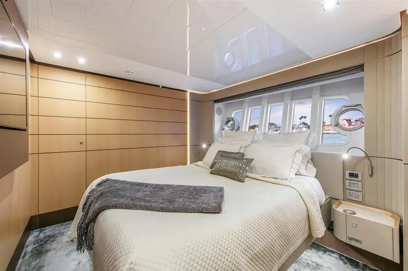 Lontano Yacht Photos Pics Luxurious bedroom interior of 2016 Ferretti 960 yacht with modern design and ocean view.