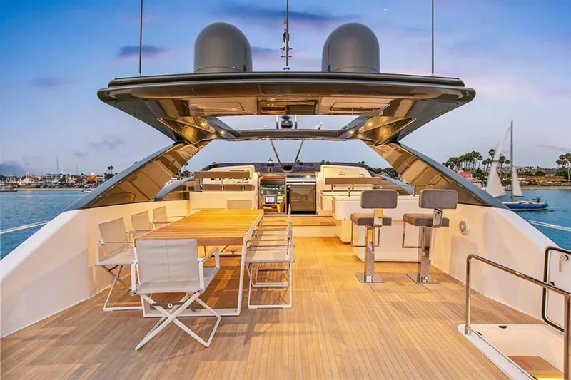 Lontano Yacht Photos Pics Luxurious 2016 Ferretti 960 yacht deck with elegant seating and dining area at sunset.