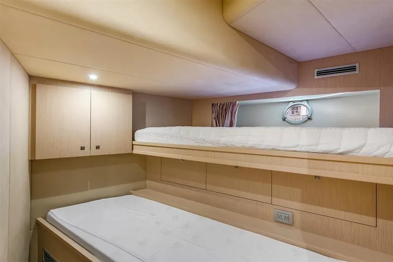 Lontano Yacht Photos Pics 2016 Ferretti 960 yacht cabin with bunk beds and modern wood finish.