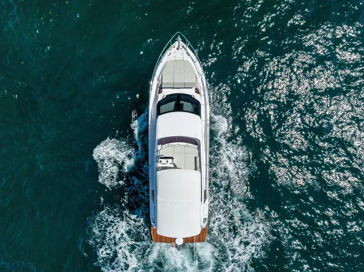 Ferretti 500 Yacht Photos Pics Aerial view of 2024 Ferretti Yachts 500 cruising on open water.