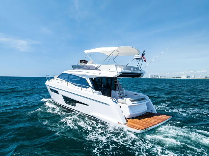 Ferretti 500 Yacht Photos Pics 2024 Ferretti Yachts 500 cruising on open sea under clear blue sky.