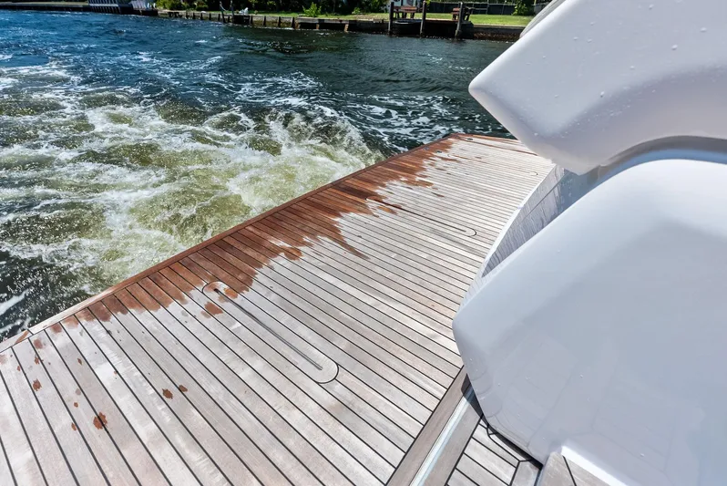 Ferretti 500 Yacht Photos Pics 2024 Ferretti Yachts 500 teak deck with water view.