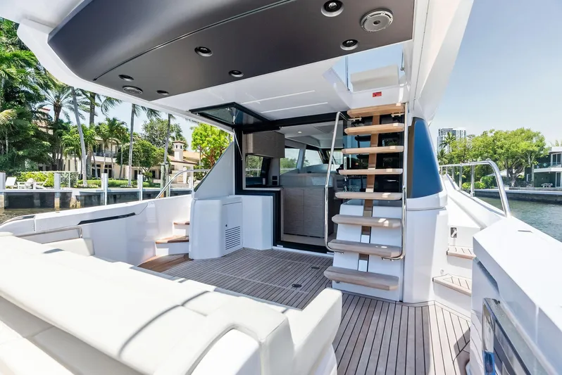 Ferretti 500 Yacht Photos Pics 2024 Ferretti Yachts 500 deck with modern seating and elegant staircase.