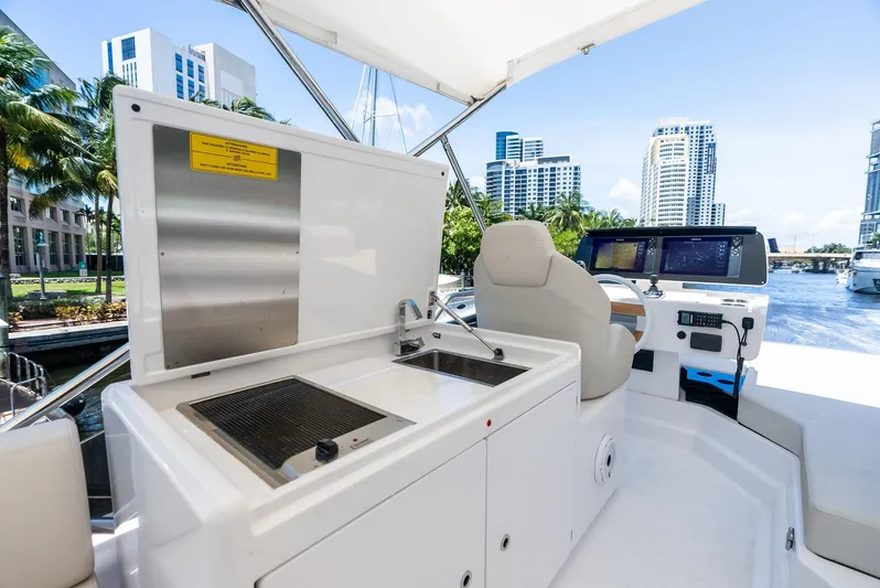 Ferretti 500 Yacht Photos Pics 2024 Ferretti Yachts 500 helm with modern navigation and outdoor kitchen setup.