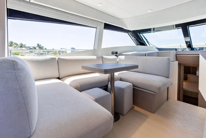 Ferretti 500 Yacht Photos Pics Luxurious interior of 2024 Ferretti Yachts 500 with modern seating and panoramic windows.
