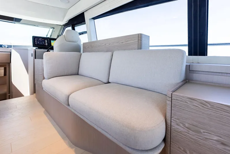 Ferretti 500 Yacht Photos Pics Luxurious interior of 2024 Ferretti Yachts 500 with modern seating and helm station.