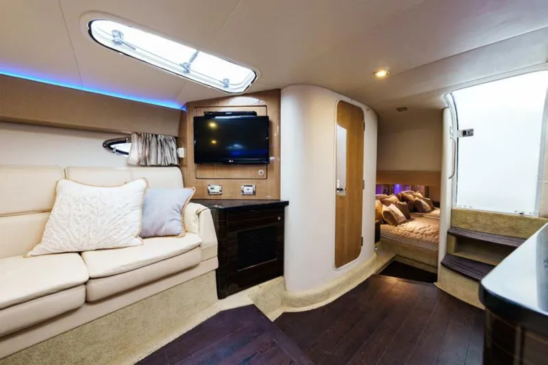 Dev Ocean Yacht Photos Pics Luxurious interior of a 2014 Formula 400 Super Sport yacht with cozy seating and modern amenities.