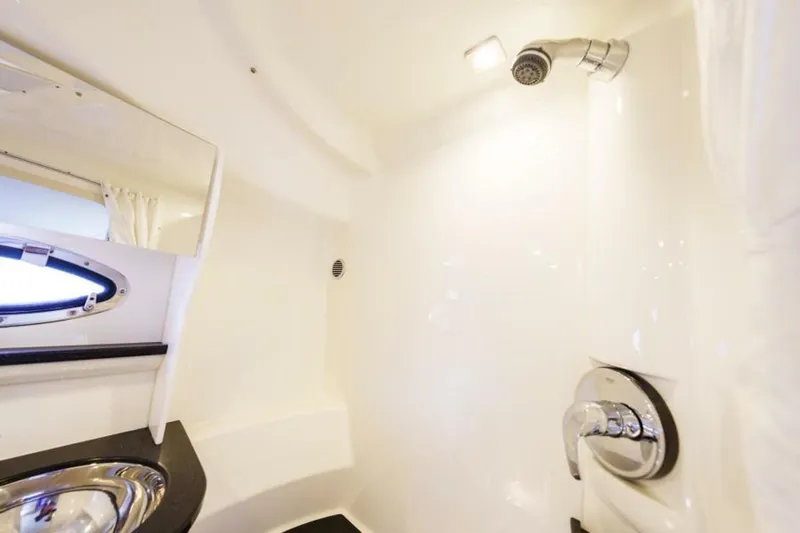 Dev Ocean Yacht Photos Pics 2014 Formula 400 Super Sport yacht bathroom with modern fixtures and porthole window.